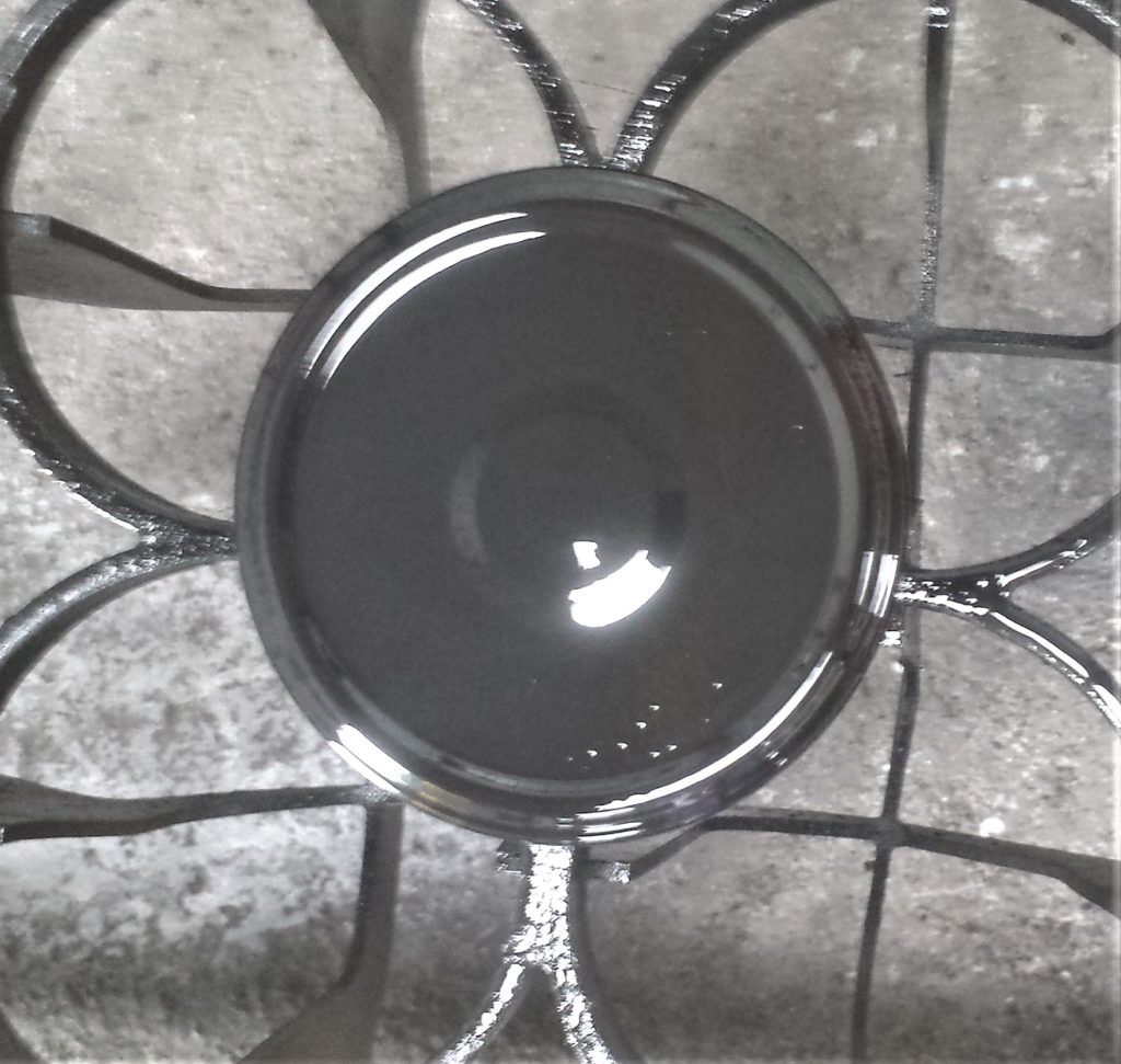 The lid after one coat of spray paint.