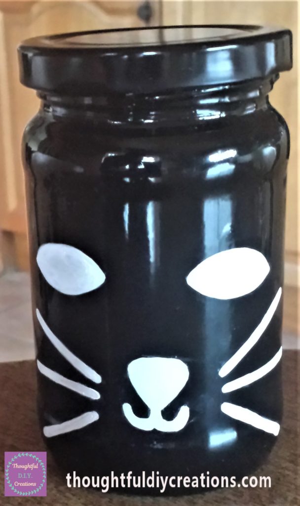 Another layer of white paint marker on the Cats eyes, nose and whiskers. 