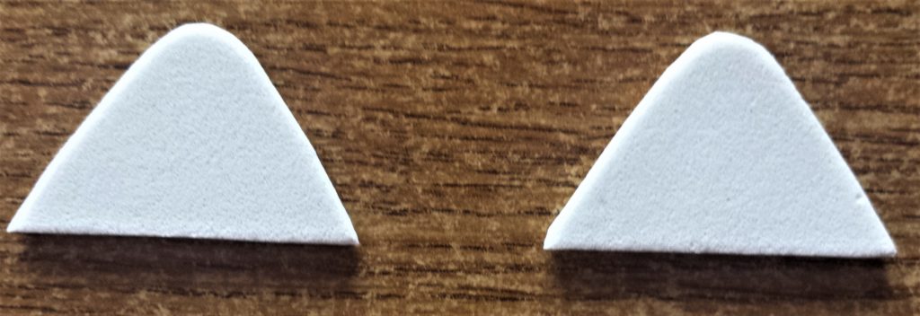 Triangle shapes cut out using a small scissors.