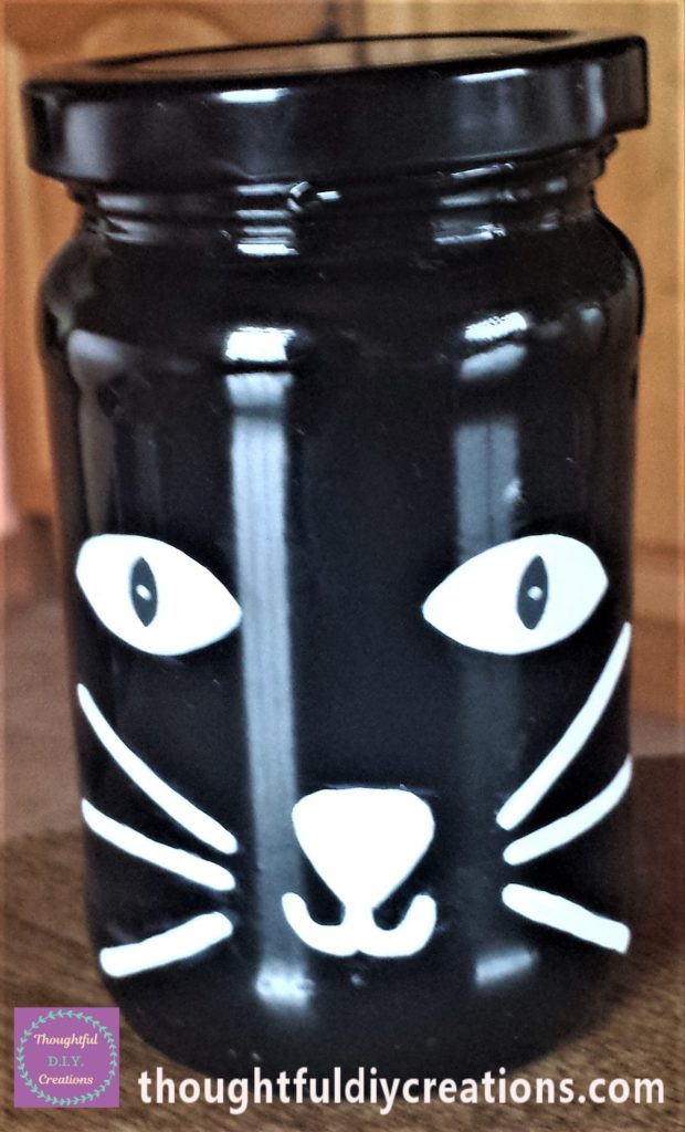 White dot added to the cats eyes using a white paint pen.