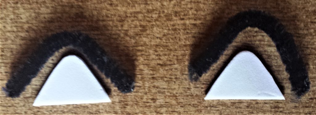 Pipe cleaners cut out to fit the triangle shape foam.