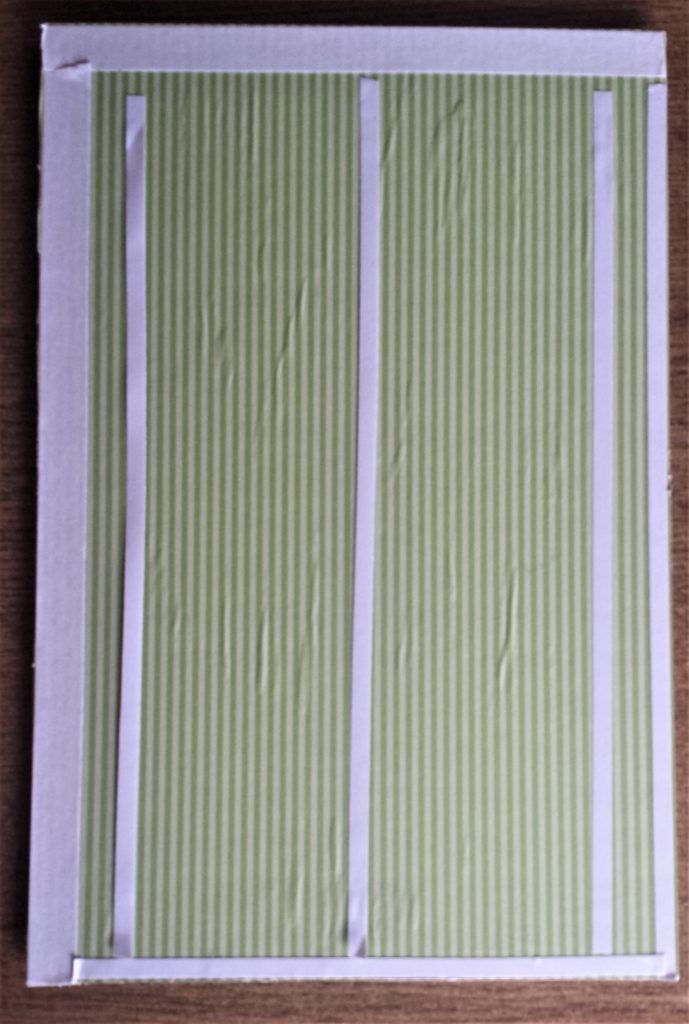 Double-Sided Tape on the green sheet on the frame.