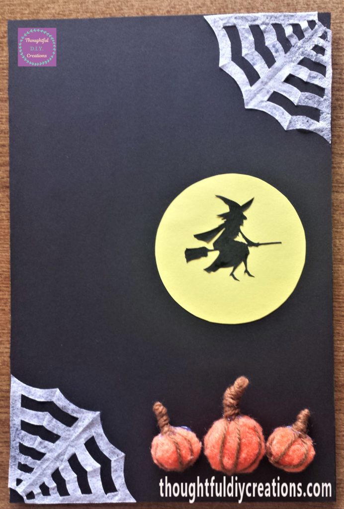 Moon attached to the Halloween sign with pritt stick.