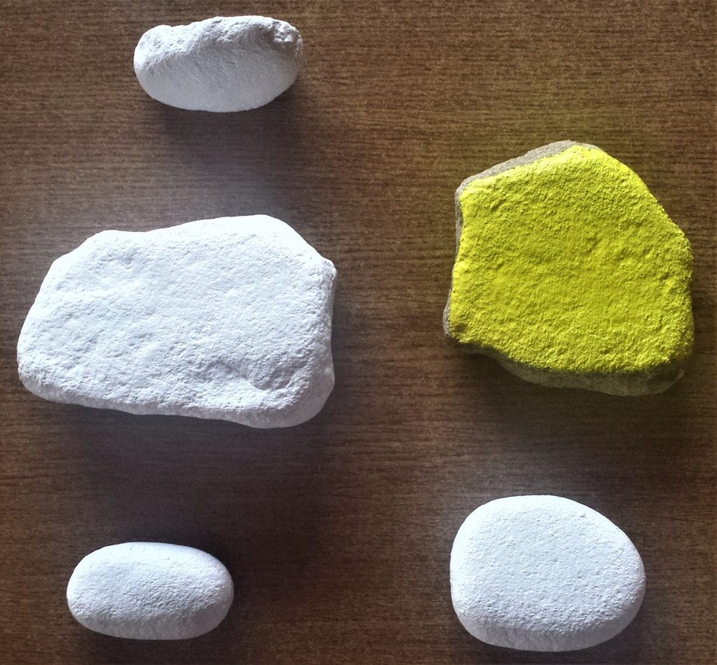 Third layer of paint added to the white and yellow stones.