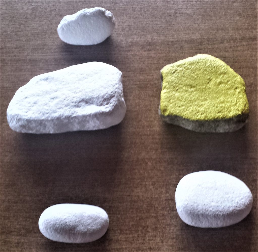 Final layer of yellow and white paint on the stones.