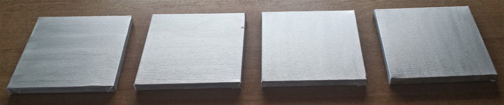 Side view of the first layer of painted canvases.