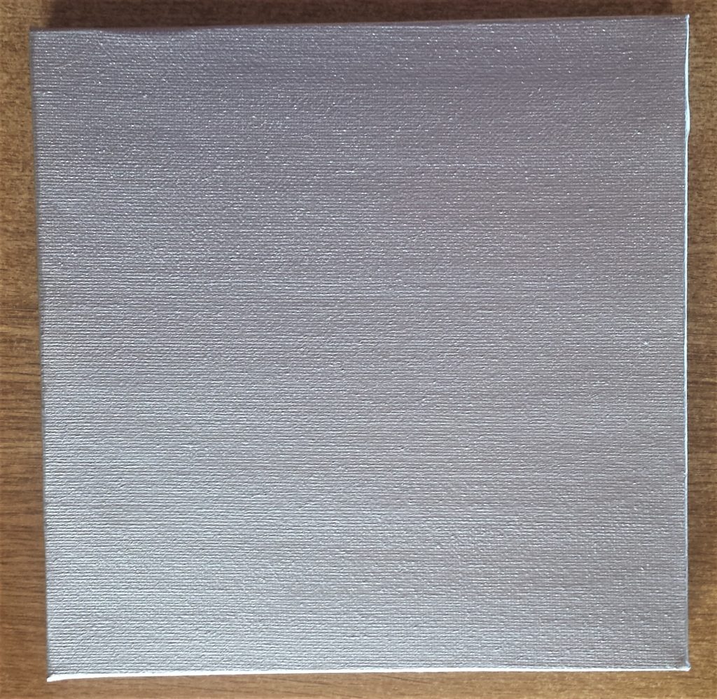 Close up image of one canvas after the third layer of paint.