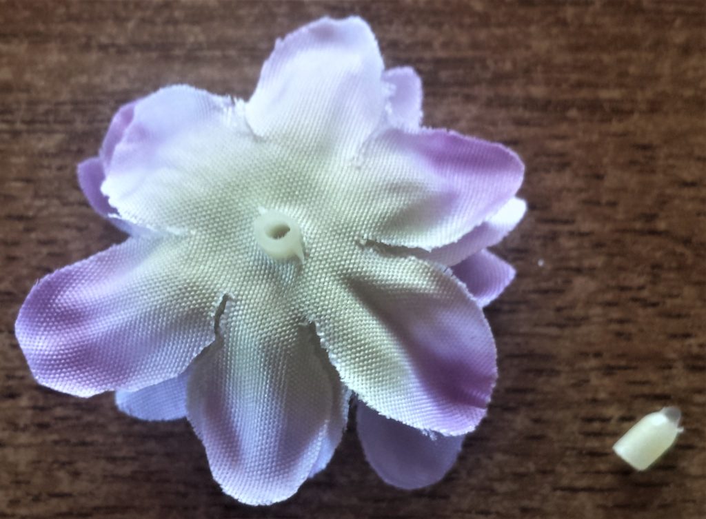 Plastic mid section cut from the flower.