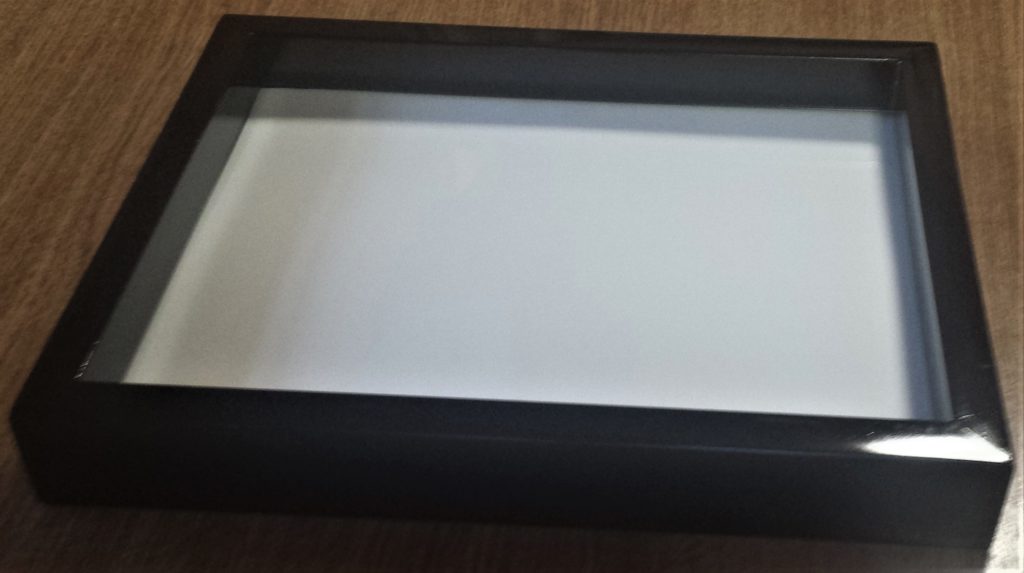 The white board in the frame.