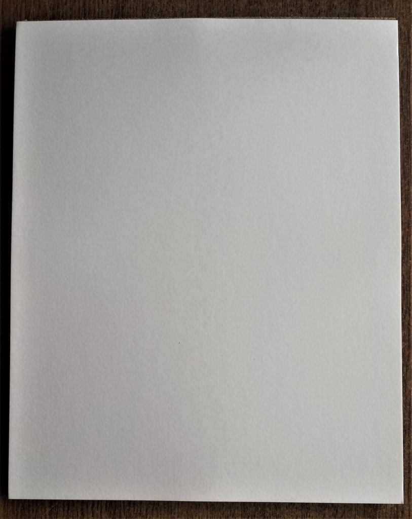 White board stuck to the brown board.