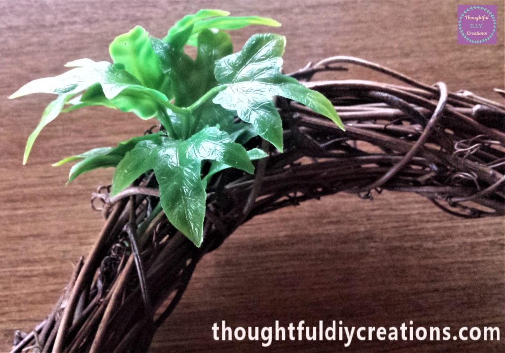 The section of leaves pushed into the wreath.