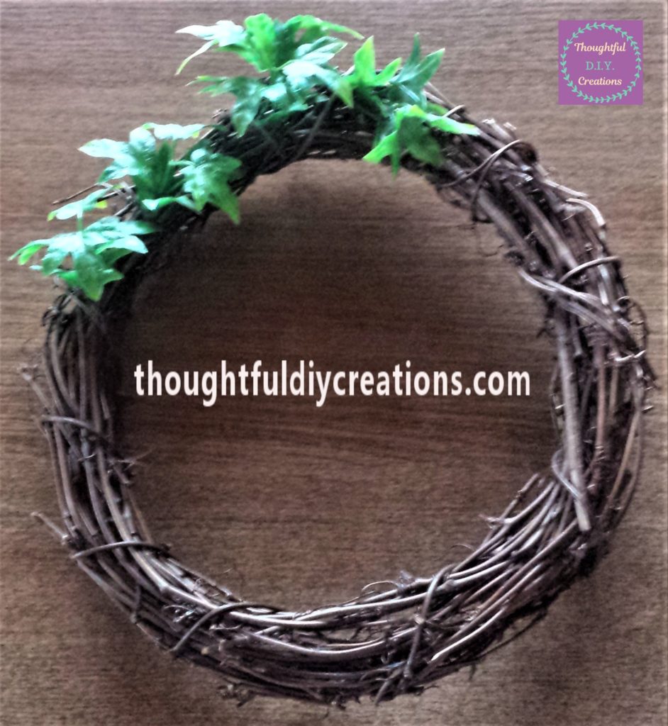 More leaves added to the wreath.