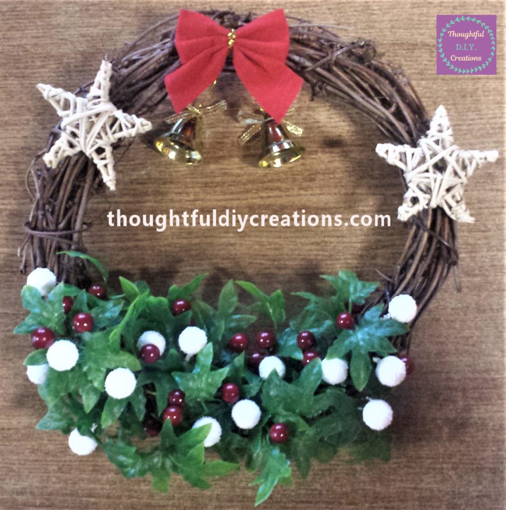 Bow added to the top of the wreath.