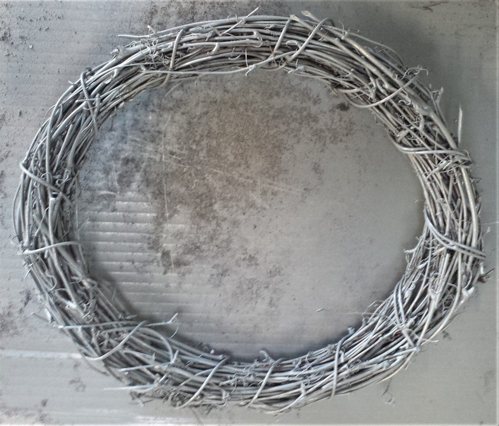 First layer of grey paint on the wreath.