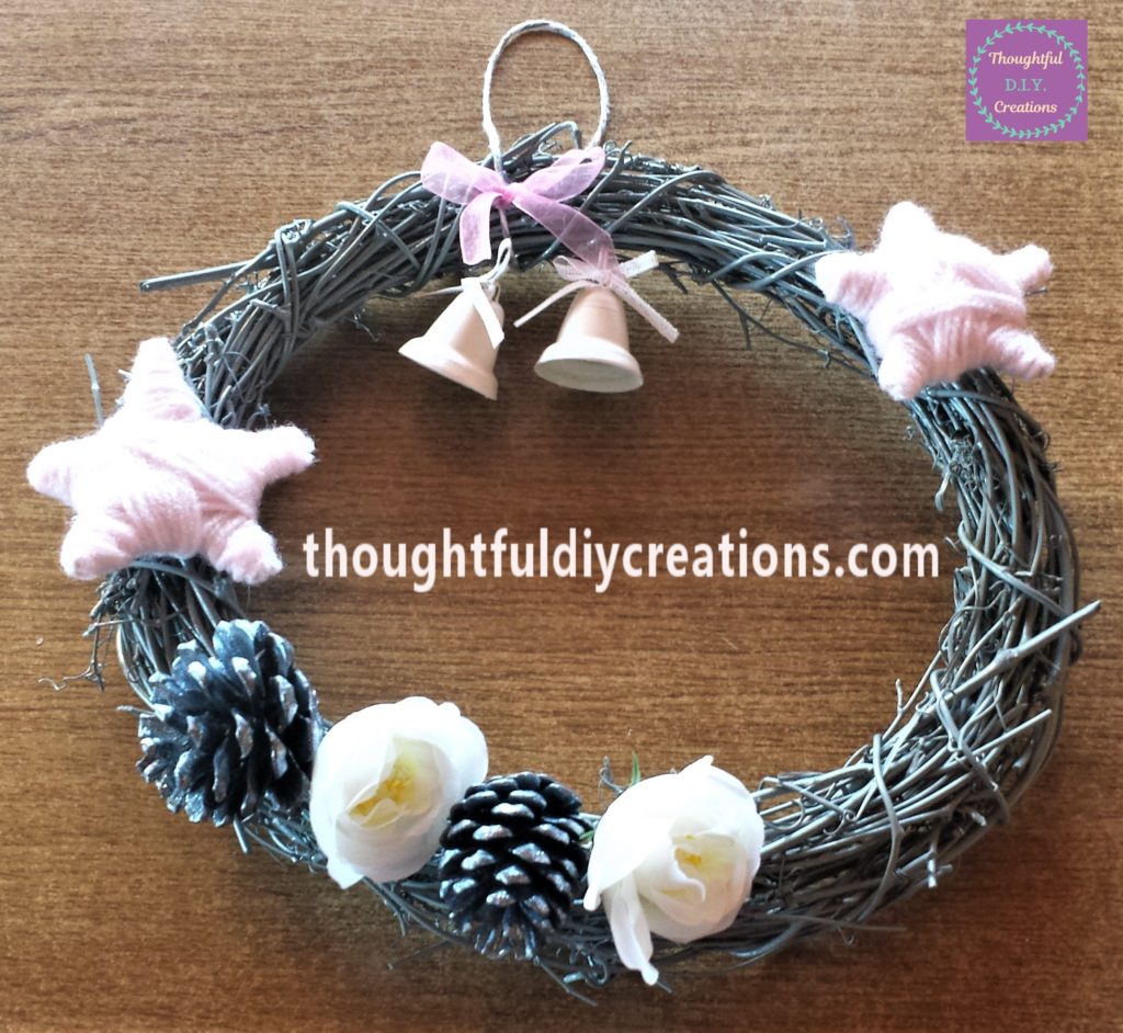 2 Pine cones and 2 flowers added to the wreath.