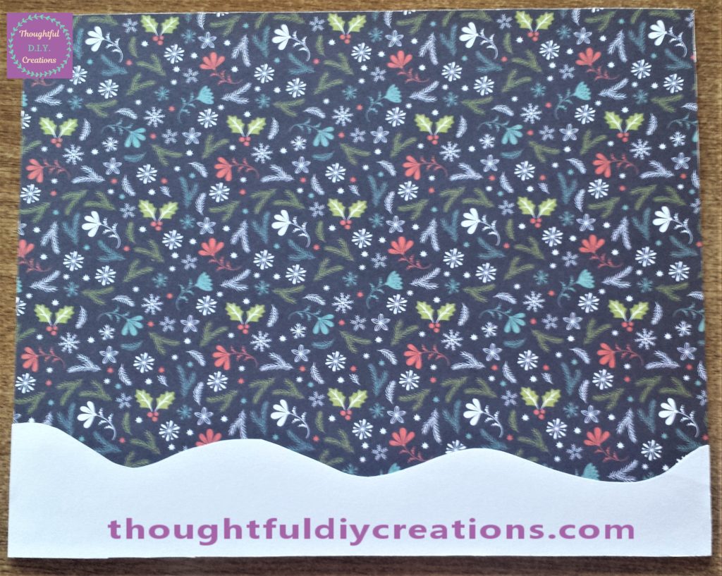 The snow glued to the Christmas paper using pritt stick.