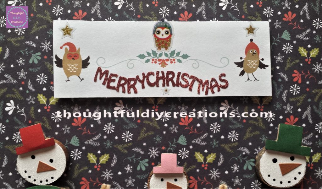 The Christmas card attached to the Christmas scene.