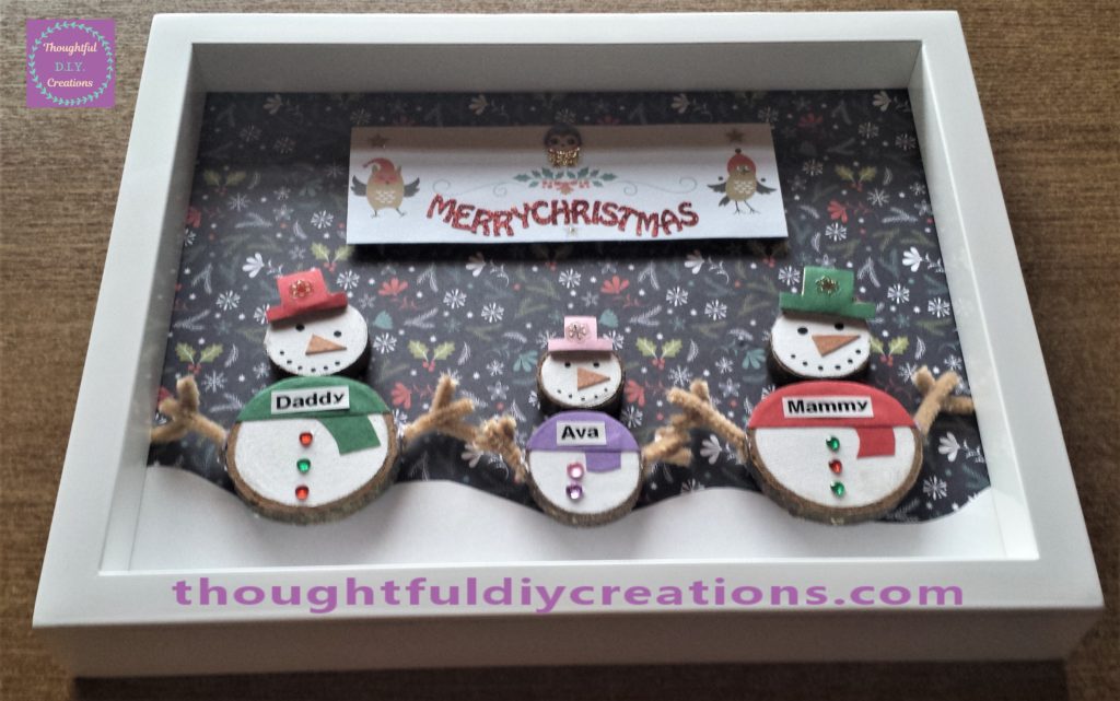 The Christmas scene put back into the frame.