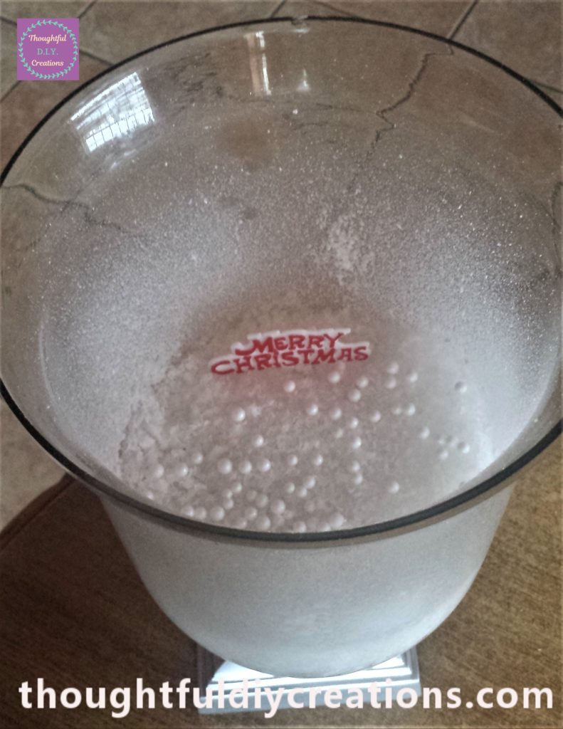 The 'Merry Christmas' sign in the snow.