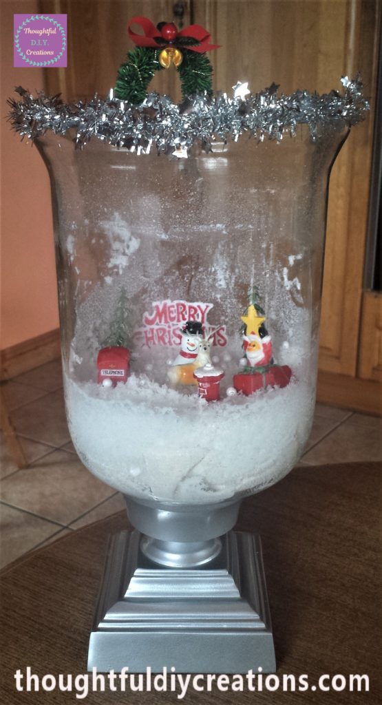The snow spray wiped off the front of the glass jar.