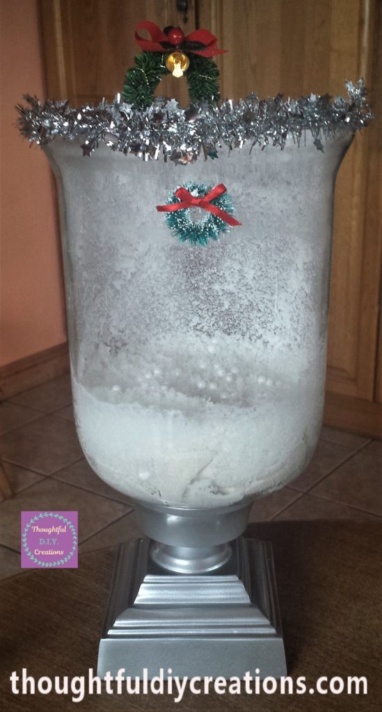 Mini Christmas wreath added to the front of the glass jar.