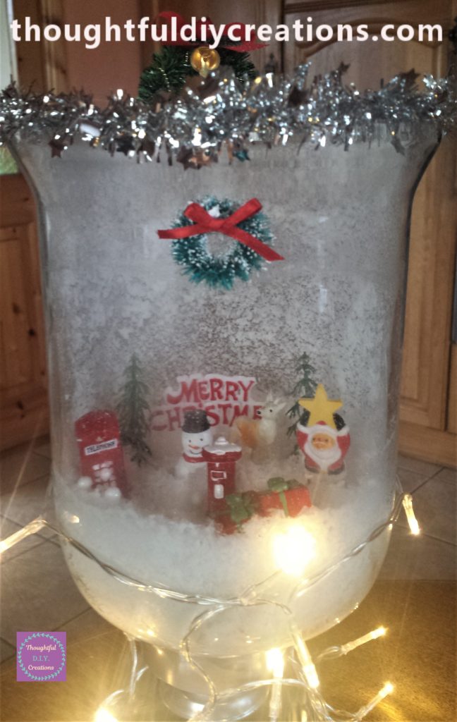 The completed Christmas Scene Candle Jar.