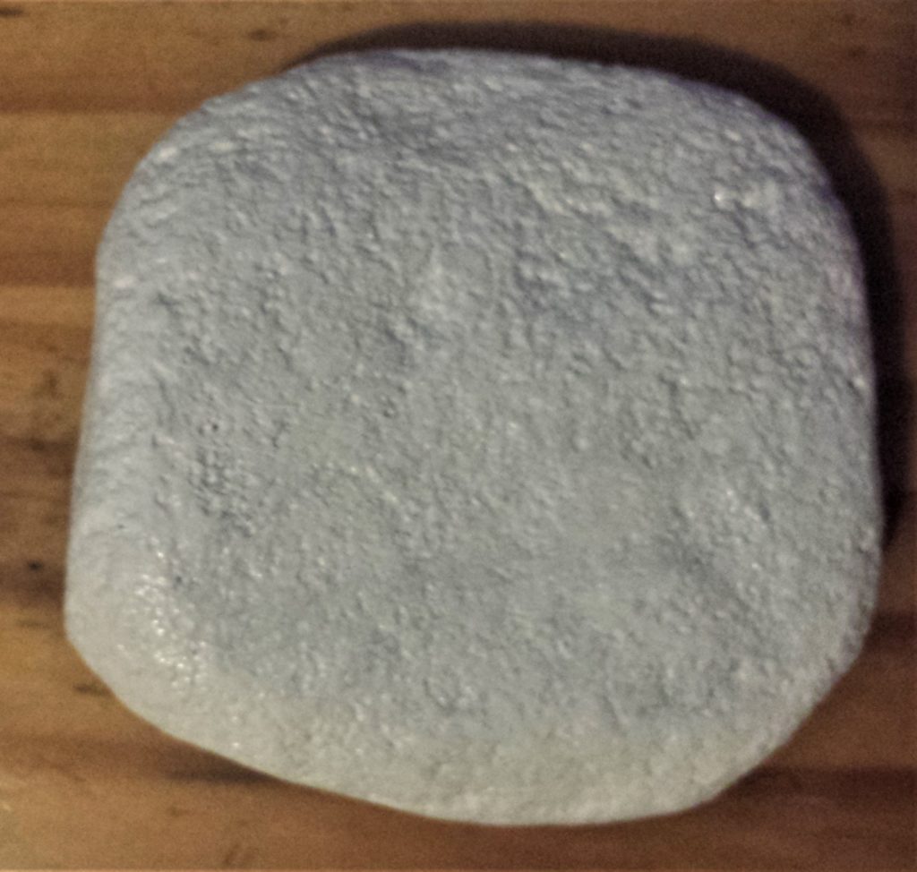 First layer of paint on the front and sides of the stone.