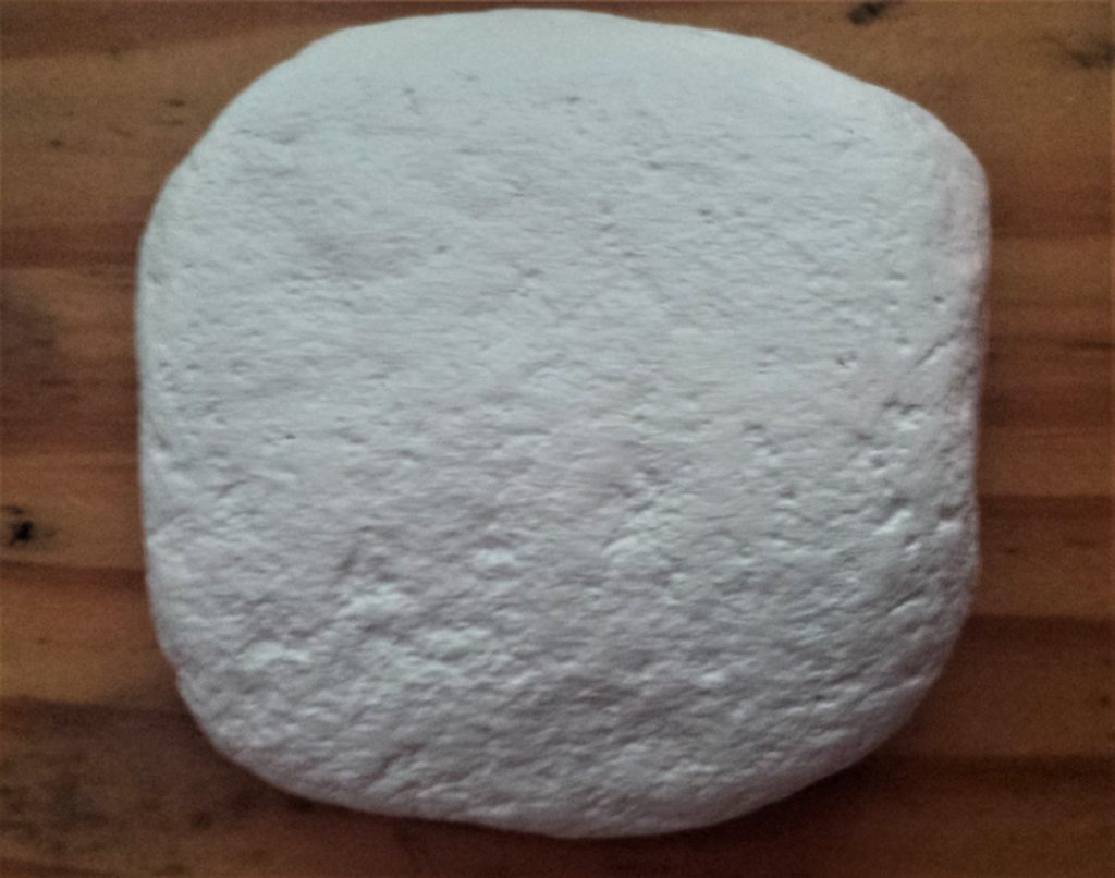 Five layers of white paint added to the stone.