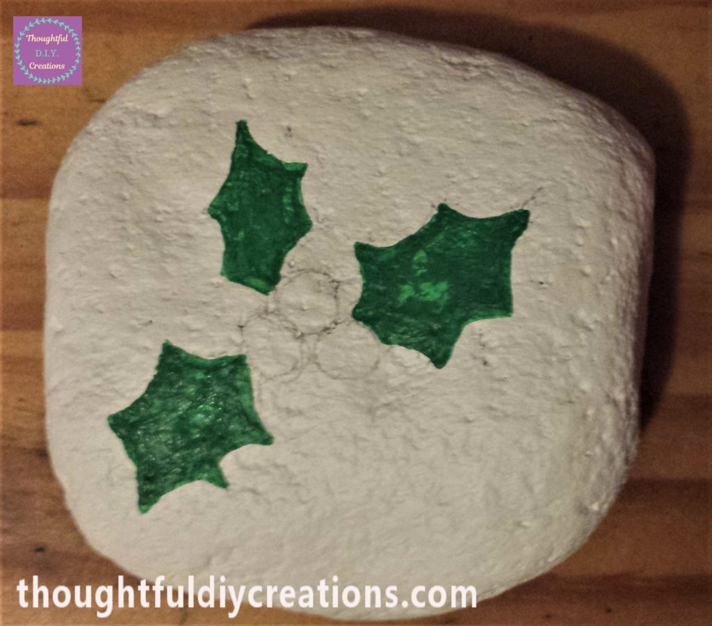 The leaves painted using green acrylic paint and a small paintbrush.