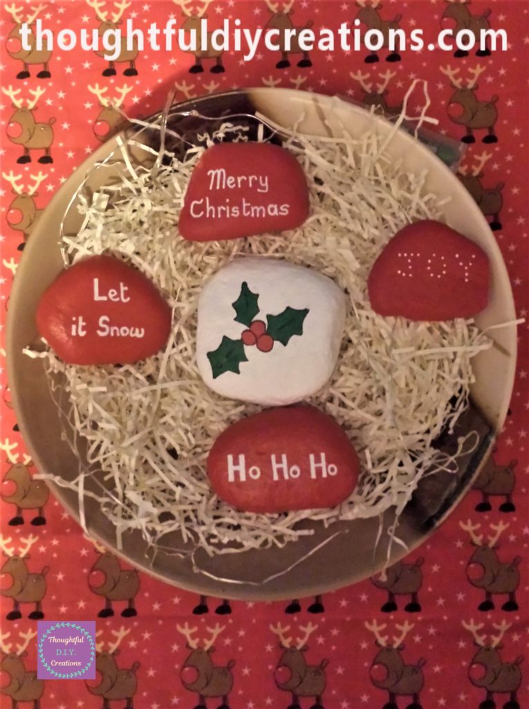 The stones in a ceramic bowl with raffia.