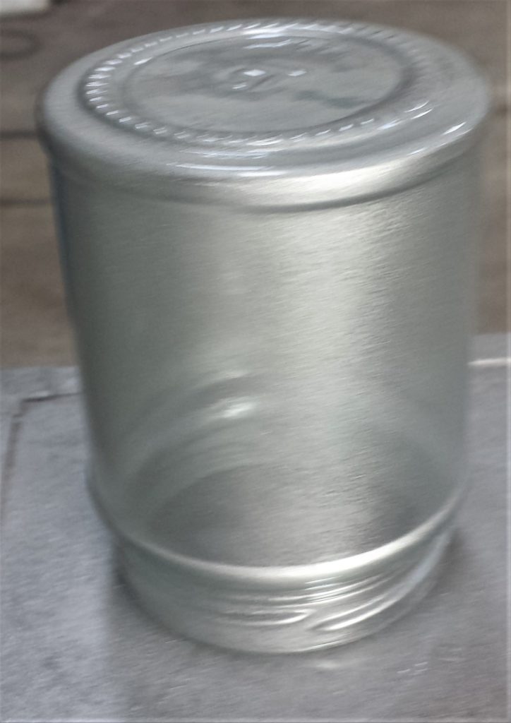 First layer of spray paint to the smallest jar.