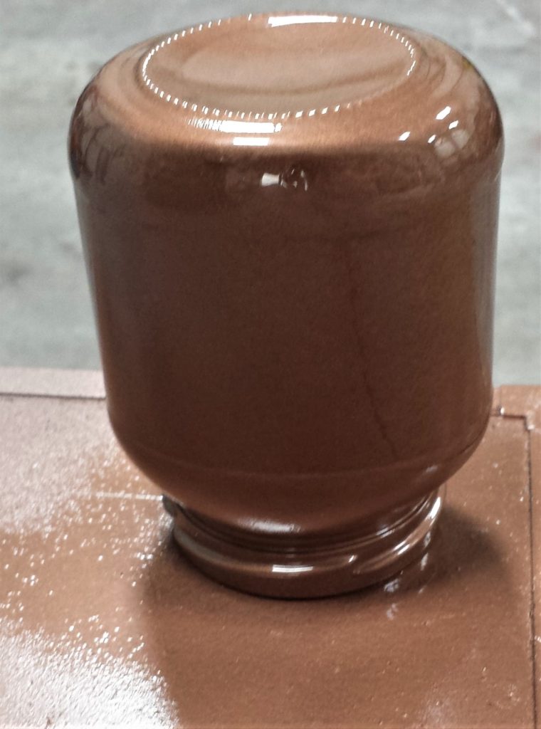 Third layer of spray paint on the jar.