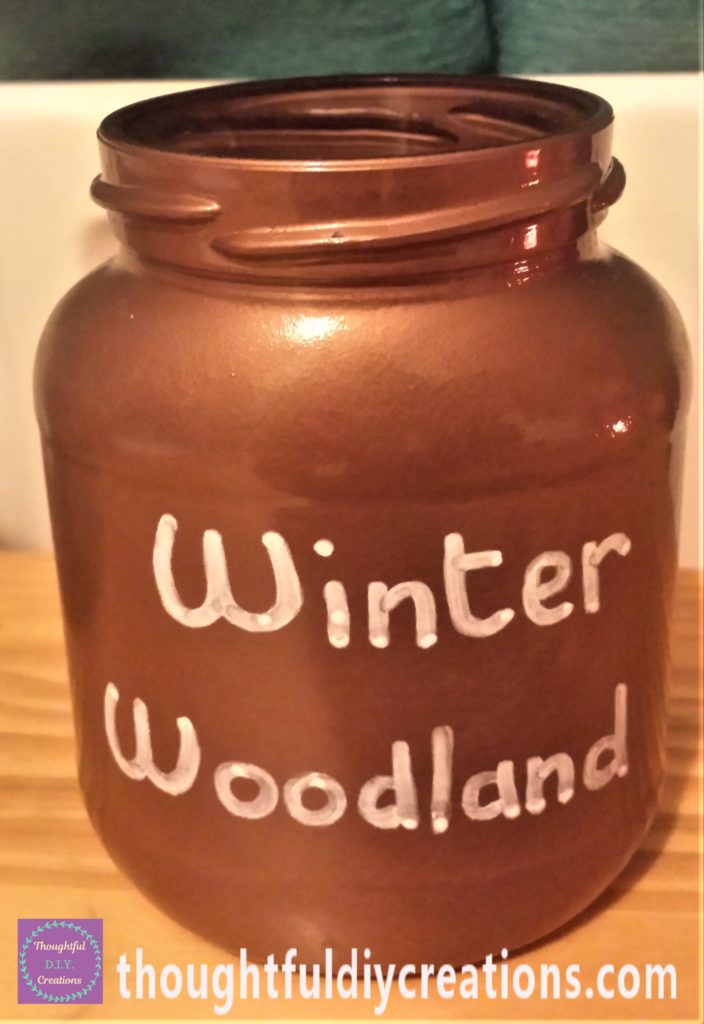 'Winter Woodland' written on the copper jar with the white paint marker.