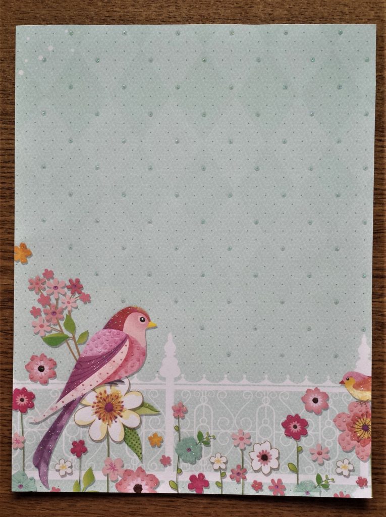 The marked lines cut out of the blue patterned sheet with a small sharp scissors.