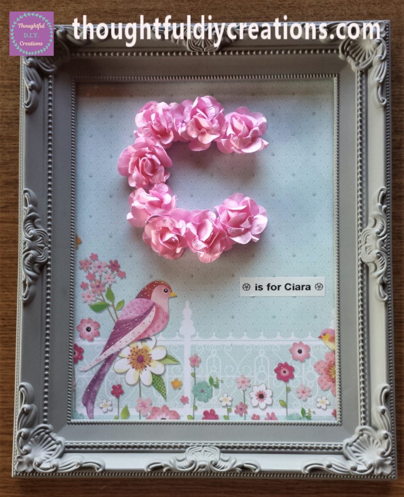 'is for Ciara' written with my 'DYMO Label Maker' and printed out and attached to the frame.