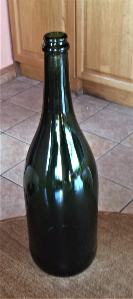 The bottle with the label removed, rinsed and dried.