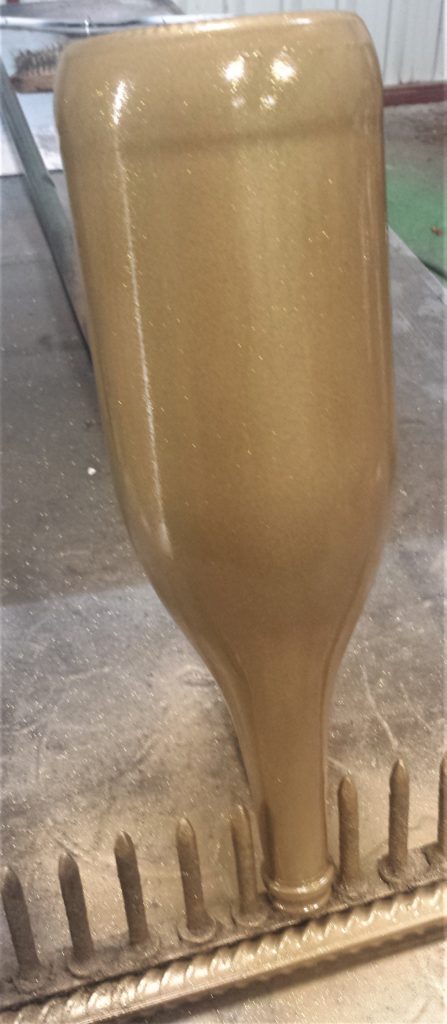 Glitter Gold Spray Paint applied to the Bottle.