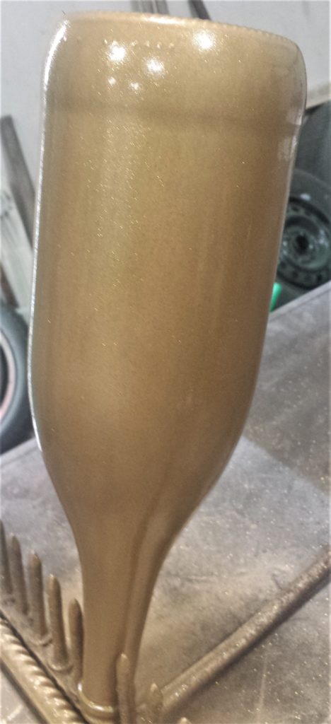 Second layer of Glitter Gold Spray Paint on the Bottle.