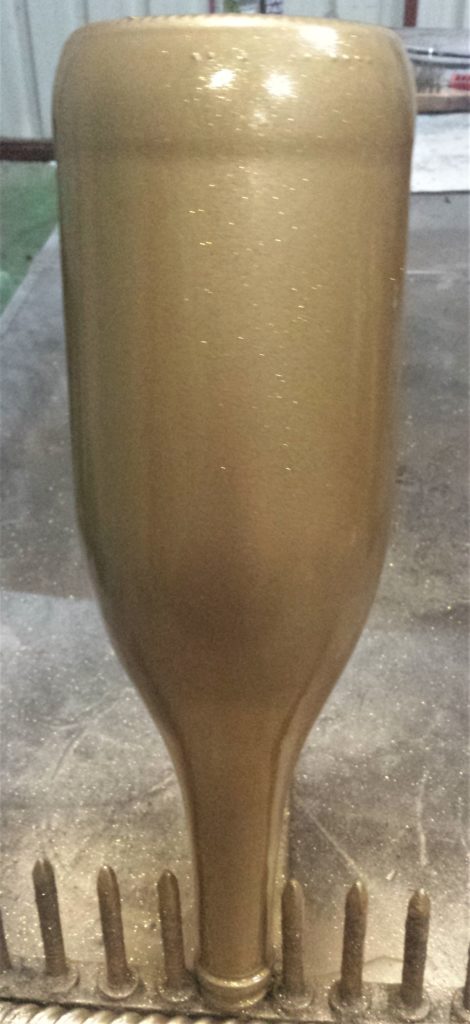 One layer of a 'Clear Top Coat' applied all over the Bottle.