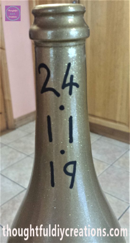 Close-up-image of the date on the neck of the bottle.