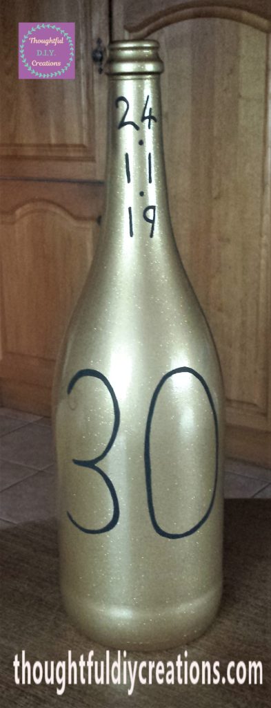 A couple more layers of the paint marker added to the number 30 on the bottle.