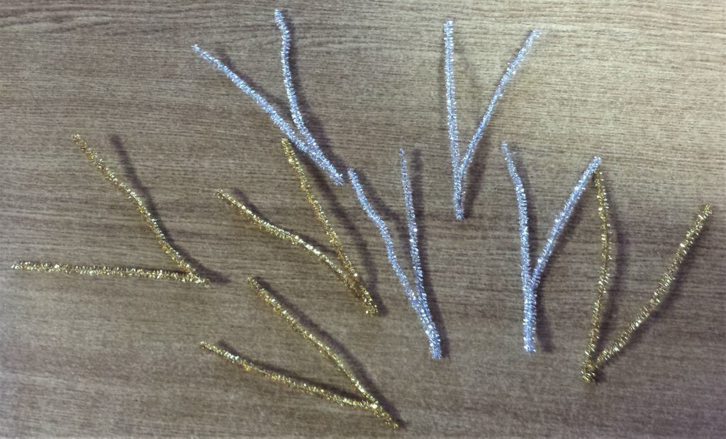 Each pipe cleaner twisted in half and squeezed in on the bottom.