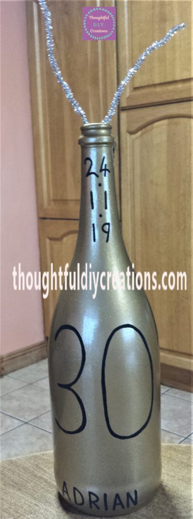 Silver Pipe Cleaner hot glued to the inside of the bottle.