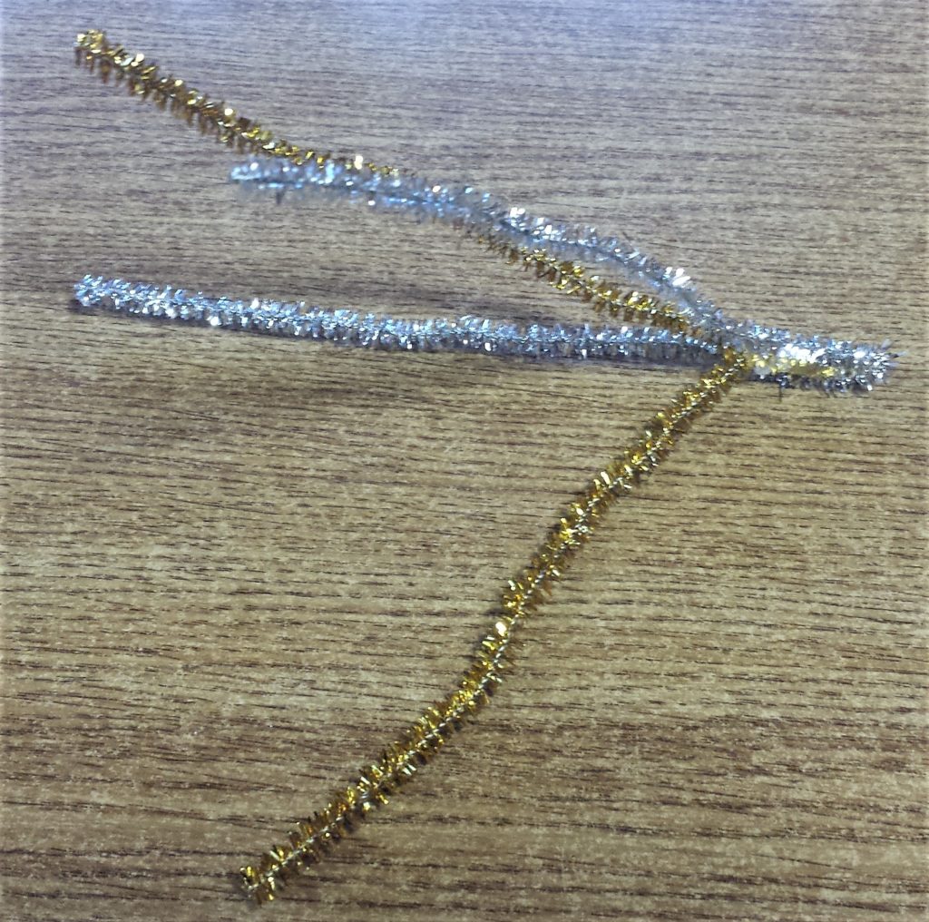 Another angle of the silver and gold glitter pipe cleaners hot glued together on the bottom.