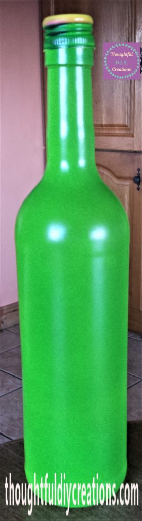 The bottle and lid brought back inside.