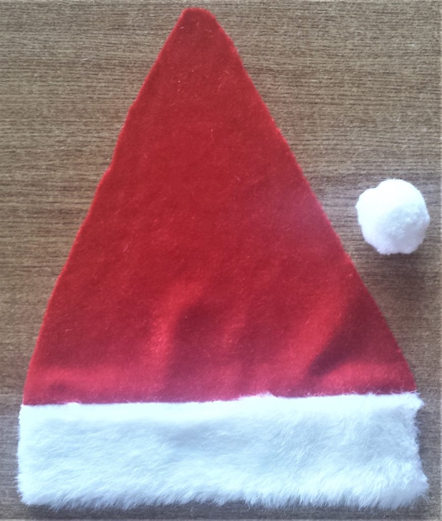 One side of the Santa hat cut off as well as the pom pom.