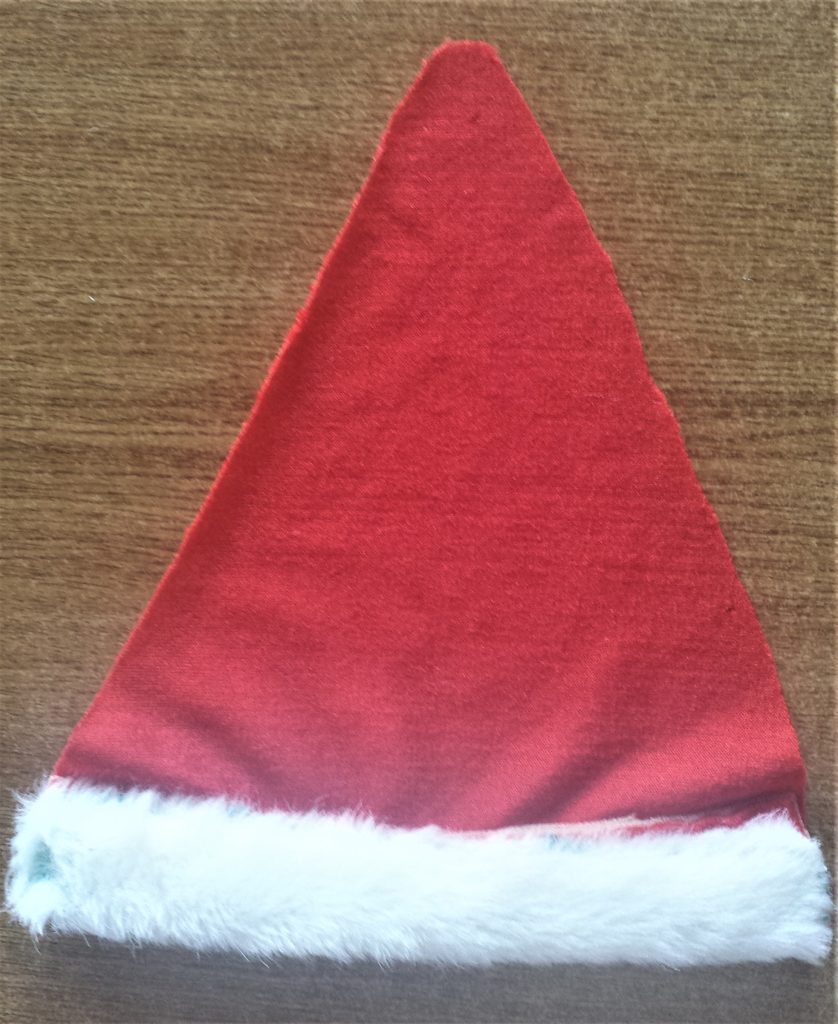 The white fur of the Santa hat turned over in half with the bottom edge of the fur hot glued to the top edge of the fur.