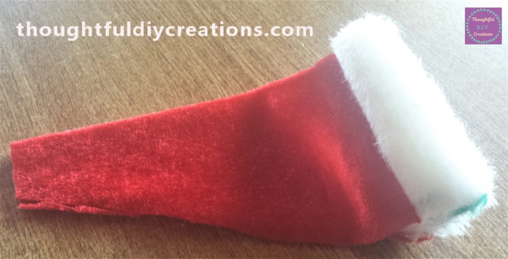 The Santa hat in position ready to be hot glued to form the hat.