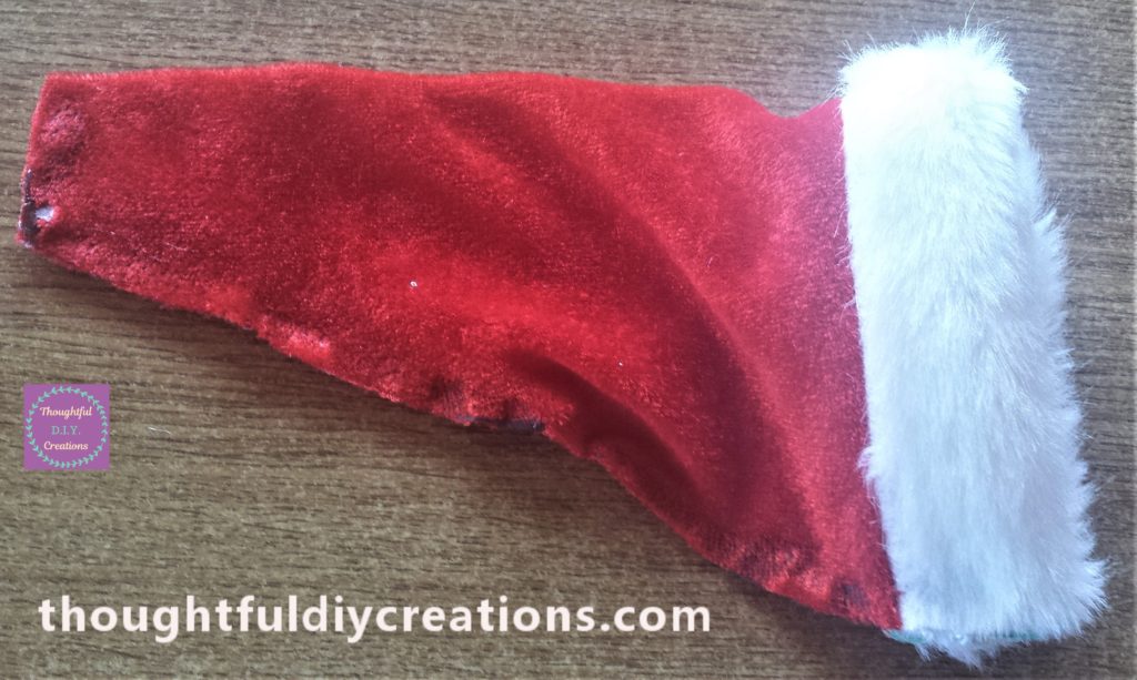 The edges of the Santa hat glued together to form the shape of the hat.