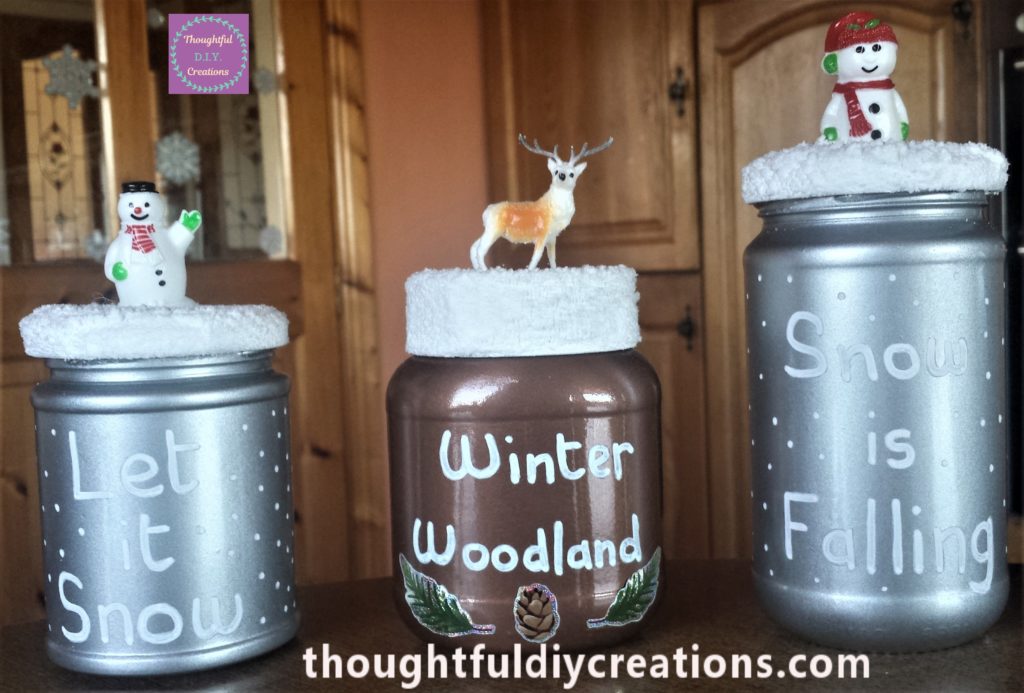 Front view of 3 D.I.Y. Christmas jars.